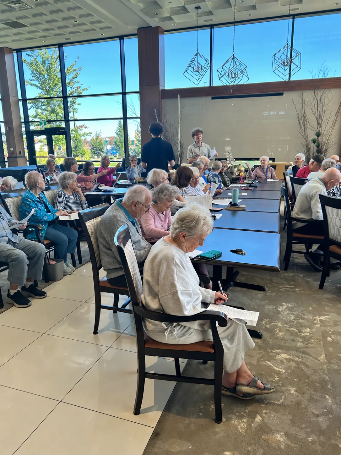 Mario and Will speaking with residents at the Wellings seminar